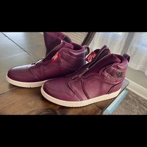 Nike women Jordan’s. Zip up. Only wore once.